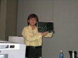Cathy Liu holding 286-12 during presentation